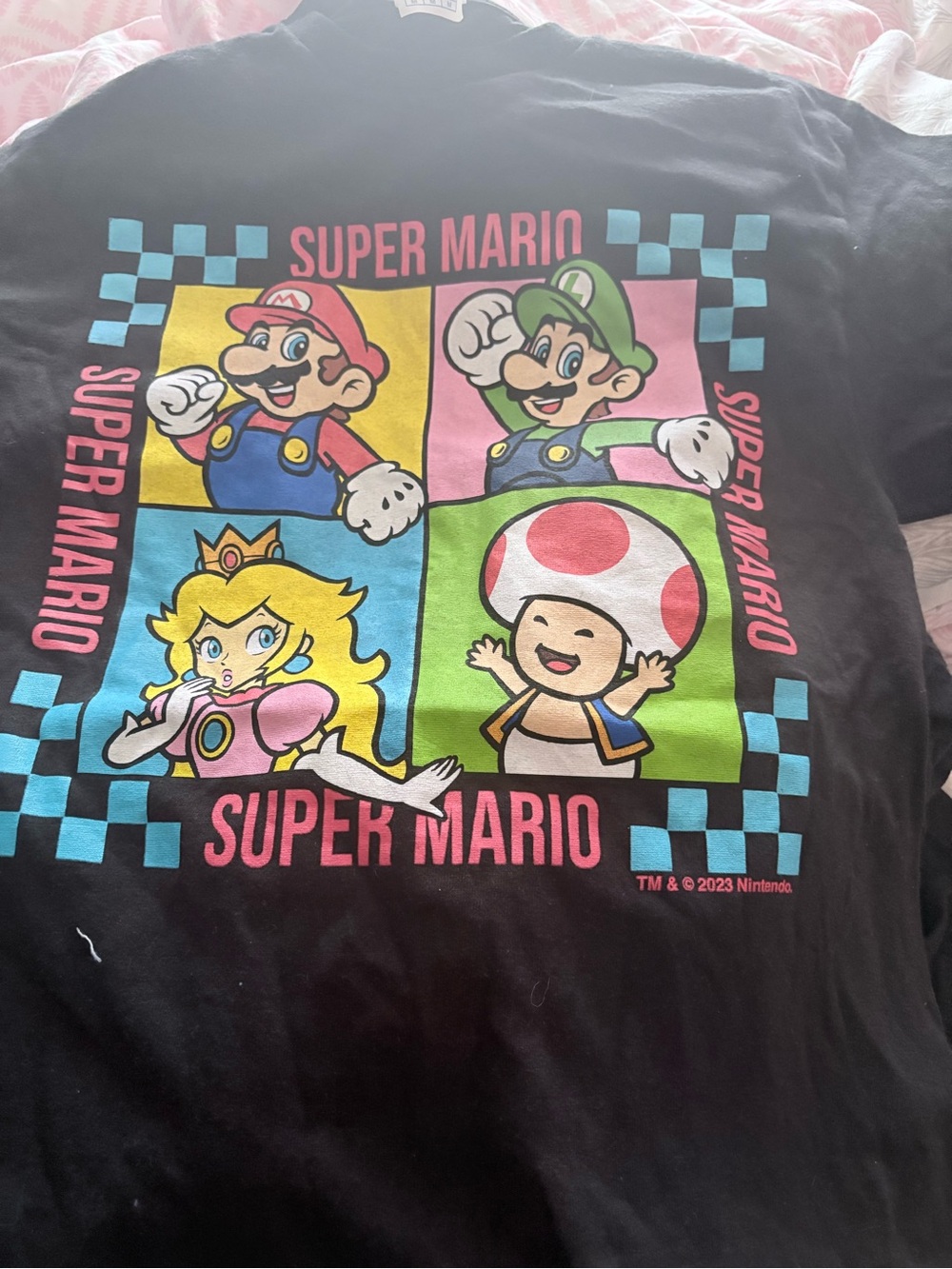 Nintendo Super Mario Black Tee with Pink, Blue, Green & Yellow Graphics